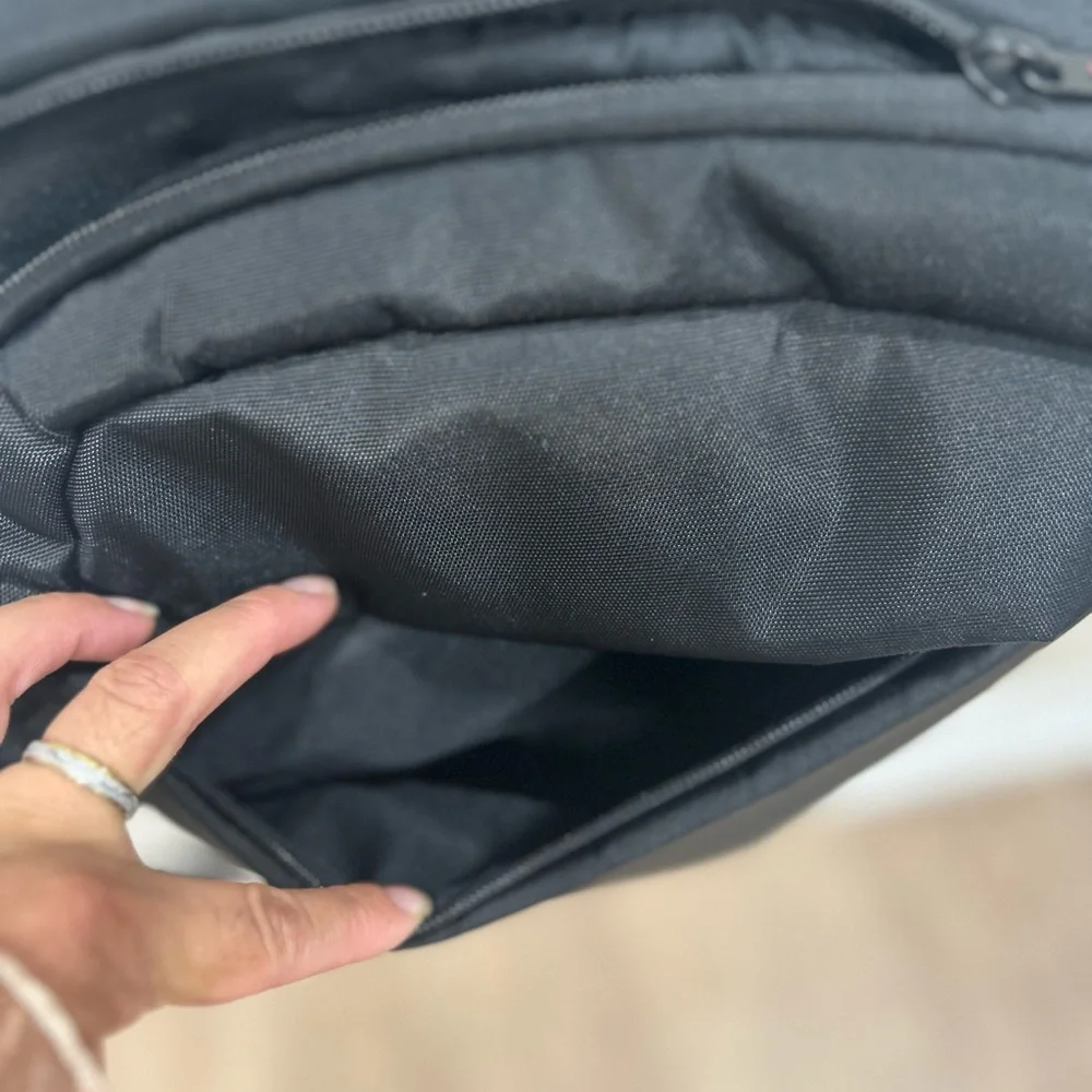 Compact Black Men's Backpack with Subtle Red Accents